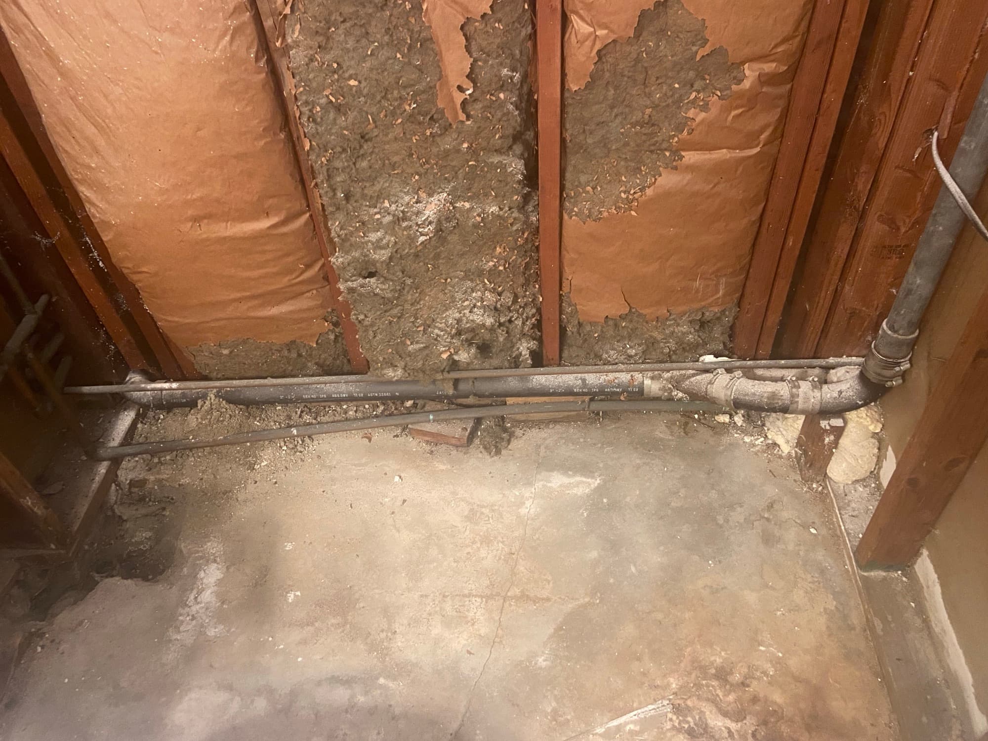 ABS drain pipe run along floor joists with a repair coupling, Orange County, CA