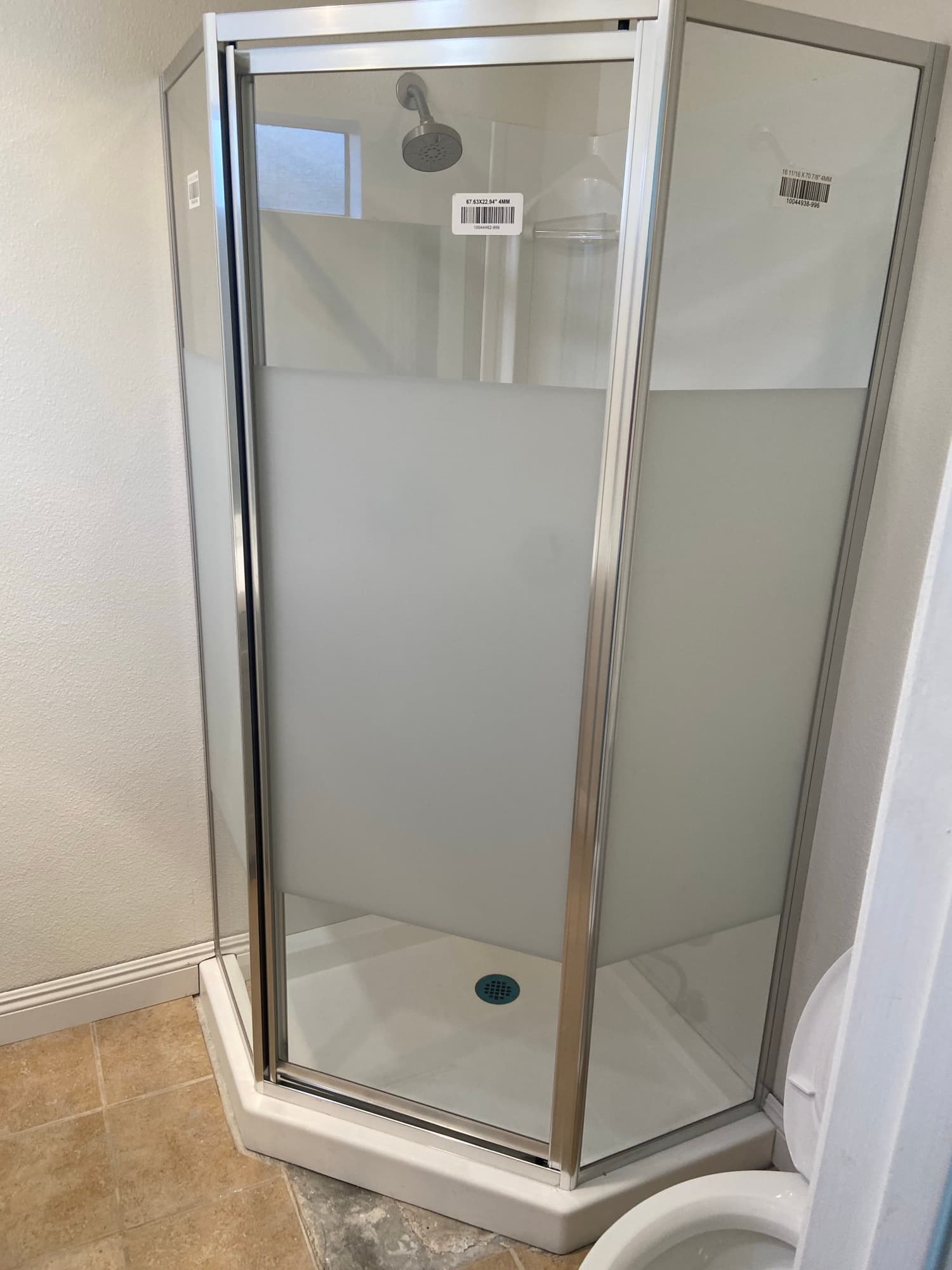 Frosted glass sliding shower door newly installed over a tub-shower combo, Orange County, CA
